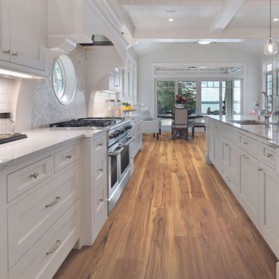 white stone countertops in a large bright kitchen